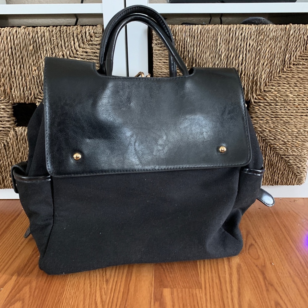 Black faux leather and canvas backpack